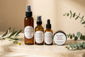 Lisa Monae Beauty Dry & Dehydrated Skin Care Set with four skincare products on an ivory surface